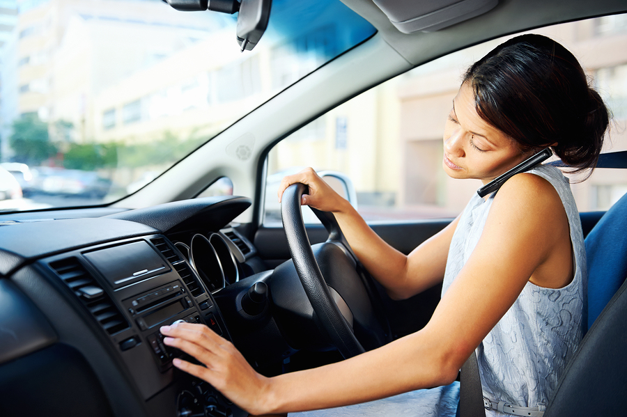 https://www.levininjuryfirm.com/wp-content/uploads/2019/08/woman-texting-driving-distracted.jpg